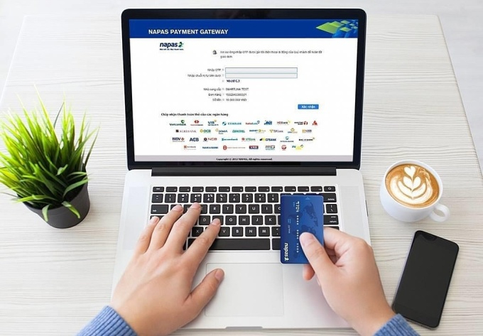 Vietcombank phối với với Napas giảm phí doanh nghiệp dịch vụ vận tải